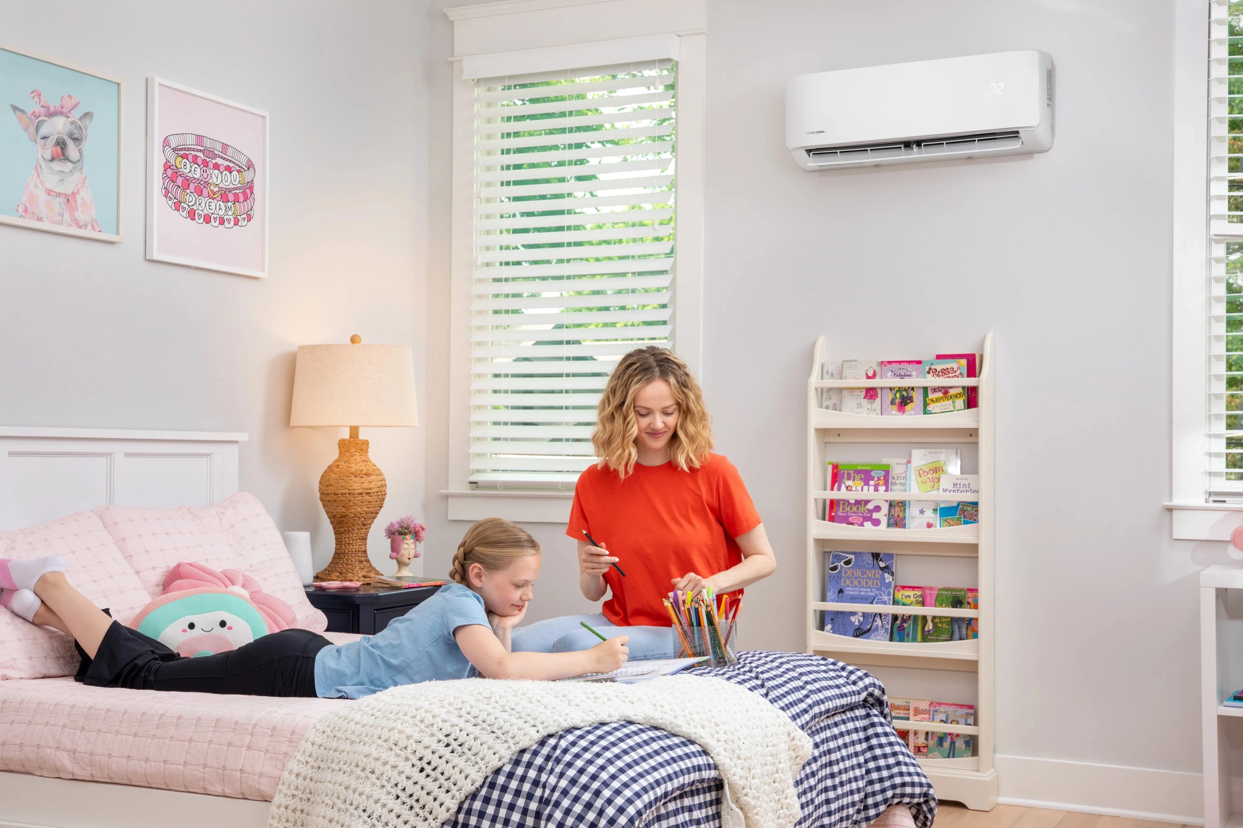MRCOOL DIY condenser unit installed outside home in winter snow
